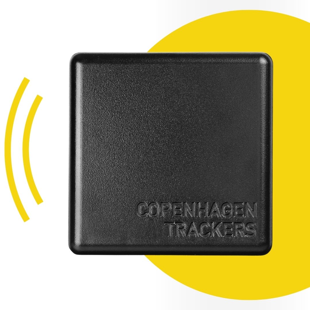 Cobblestone GPS tracker with yellow connection icon in the background.
